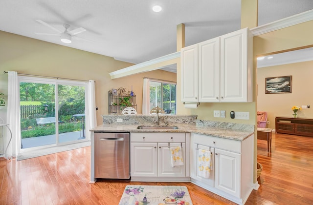 5406 E Crosland Ct, North Charleston, SC 29420 - kitchen with stainless steel dishwasher, white cabinetry, light stone counters, a peninsula, and recessed lighting