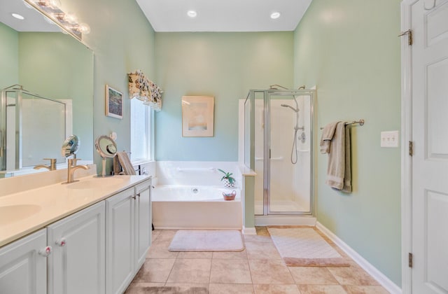 5406 E Crosland Ct, North Charleston, SC 29420 - full bath with a shower stall, a bath, double vanity, tile patterned flooring, and recessed lighting