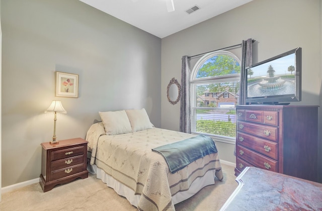 5406 E Crosland Ct, North Charleston, SC 29420 - bedroom with light carpet, multiple windows, and ceiling fan