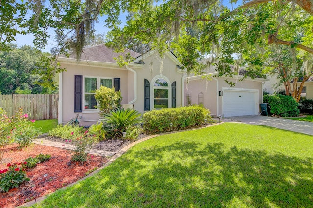 5406 E Crosland Ct, North Charleston, SC 29420 - view of front facade featuring stucco siding, an attached garage, driveway, and roof with shingles