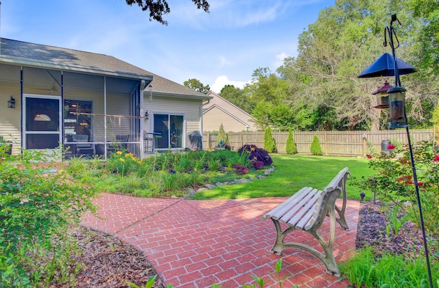 5406 E Crosland Ct, North Charleston, SC 29420 - fenced backyard featuring a patio area and a sunroom