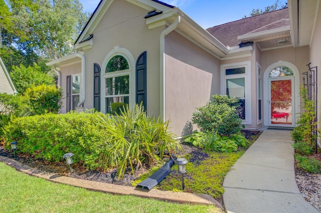 5406 E Crosland Ct, North Charleston, SC 29420 - property entrance with stucco siding and roof with shingles