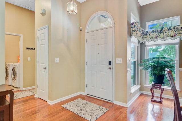 5406 E Crosland Ct, North Charleston, SC 29420 - entryway featuring washer and dryer and light wood-type flooring