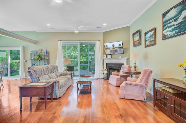 5406 E Crosland Ct, North Charleston, SC 29420 - living room with a ceiling fan, wood finished floors, a fireplace with flush hearth, plenty of natural light, and ornamental molding