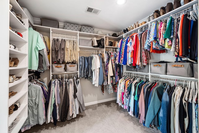 spacious closet featuring carpet flooring and visible vents