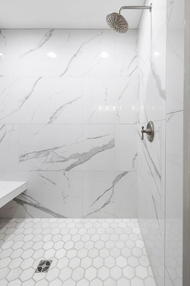 full bath featuring a marble finish shower