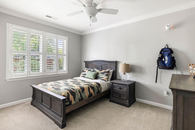 bedroom featuring crown molding, baseboards, light carpet, and ceiling fan