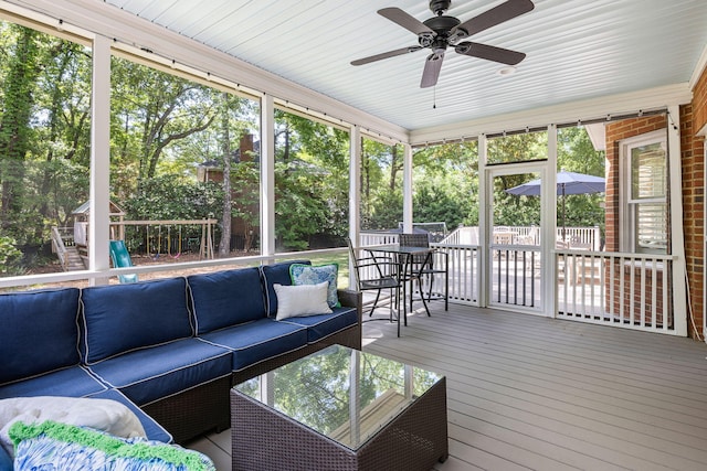 sunroom with an outdoor hangout area, outdoor dining area, and ceiling fan