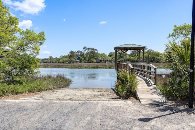 view of dock with a water view and a gazebo