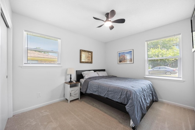 8767 Auburn Dr, North Charleston, SC 29406 - bedroom featuring light colored carpet and ceiling fan