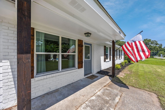 8767 Auburn Dr, North Charleston, SC 29406 - property entrance featuring brick siding and a yard