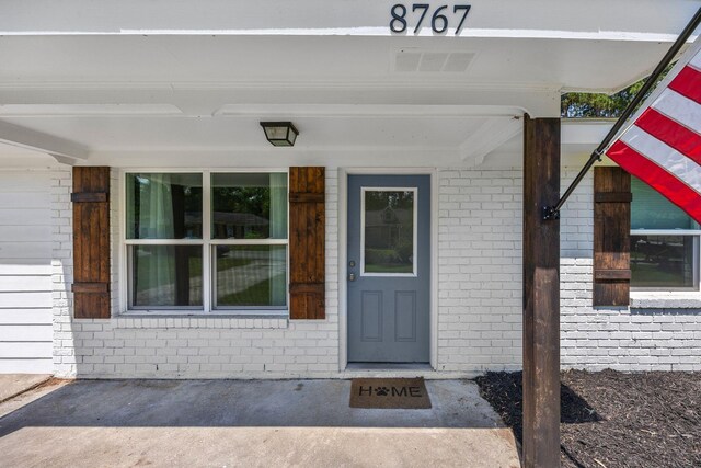 8767 Auburn Dr, North Charleston, SC 29406 - doorway to property featuring brick siding