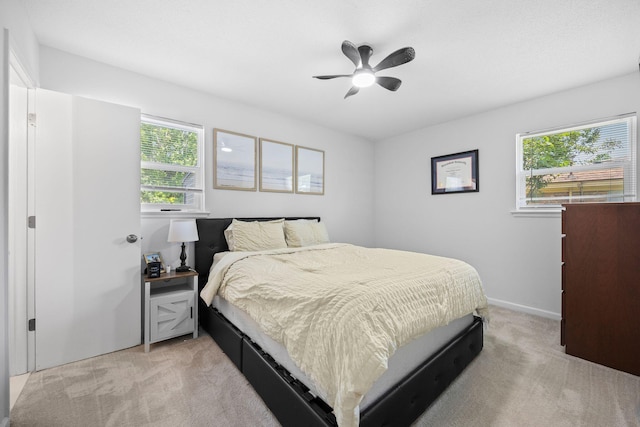 8767 Auburn Dr, North Charleston, SC 29406 - bedroom with light colored carpet and a ceiling fan