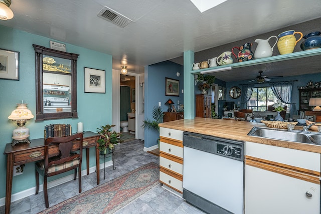 kitchen featuring white cabinetry, dishwasher, ceiling fan, and sink