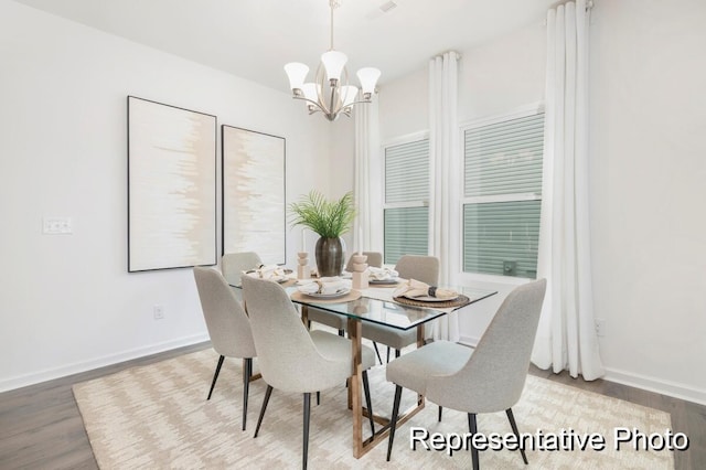 1219 Homecoming Blvd Unit Cc1-27, Ravenel, SC 29470 - dining space featuring wood finished floors and a chandelier