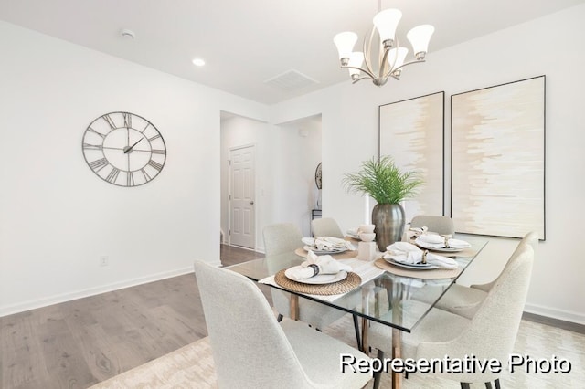 1219 Homecoming Blvd Unit Cc1-27, Ravenel, SC 29470 - dining area with wood finished floors, a chandelier, and recessed lighting