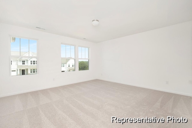 1219 Homecoming Blvd Unit Cc1-27, Ravenel, SC 29470 - unfurnished room with light carpet and baseboards