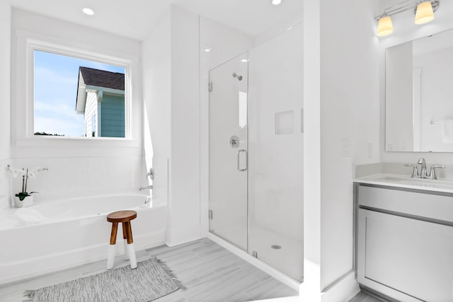 1219 Homecoming Blvd Unit Cc1-27, Ravenel, SC 29470 - full bath featuring a stall shower, a garden tub, vanity, and recessed lighting