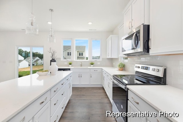 1219 Homecoming Blvd Unit Cc1-27, Ravenel, SC 29470 - kitchen with stainless steel appliances, decorative backsplash, white cabinets, healthy amount of natural light, and recessed lighting
