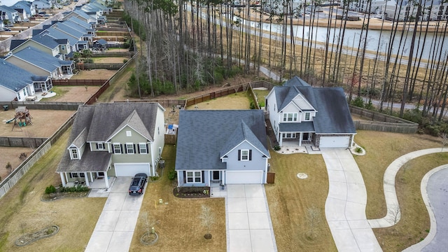 aerial view with a water view and a residential view