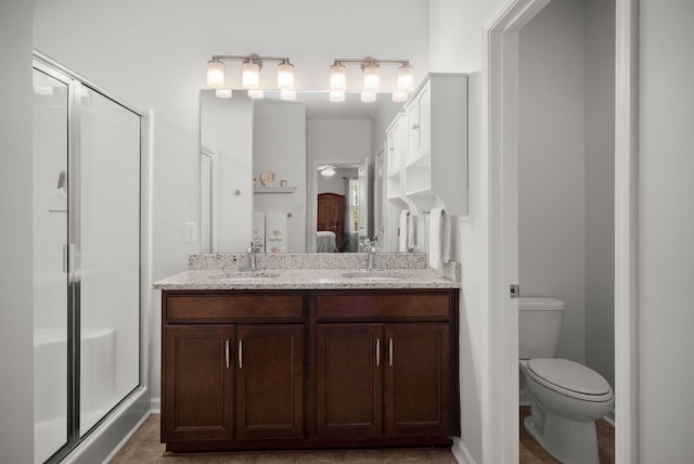 ensuite bathroom featuring a sink, a shower stall, and ensuite bath