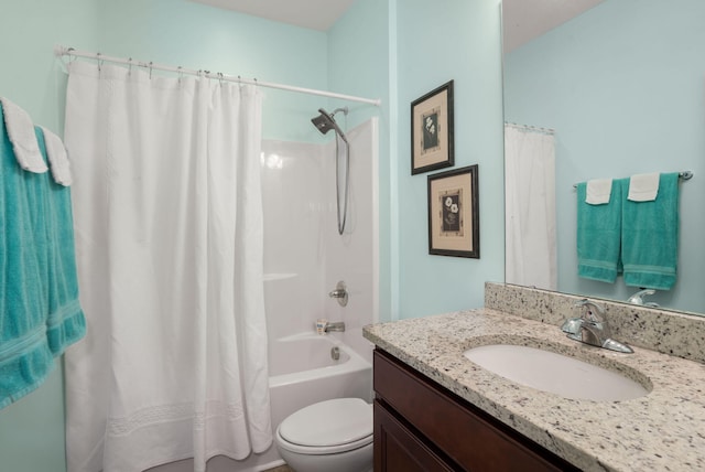 bathroom with toilet, shower / bath combo with shower curtain, and vanity