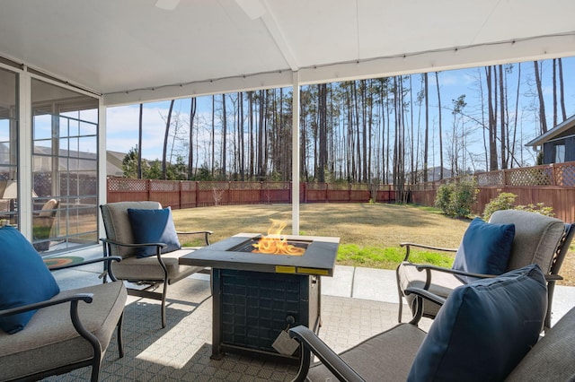 view of patio with an outdoor fire pit and a fenced backyard