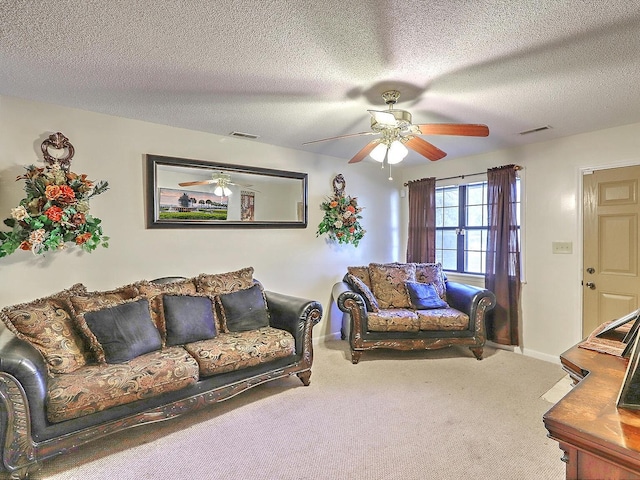 carpeted living room featuring a textured ceiling and ceiling fan