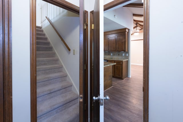 stairs with baseboards and wood finished floors