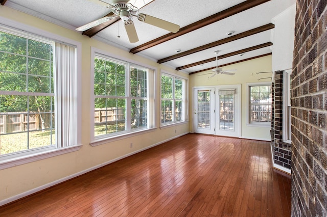 unfurnished sunroom with vaulted ceiling with beams and a ceiling fan