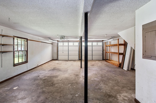 garage featuring a garage door opener and baseboards