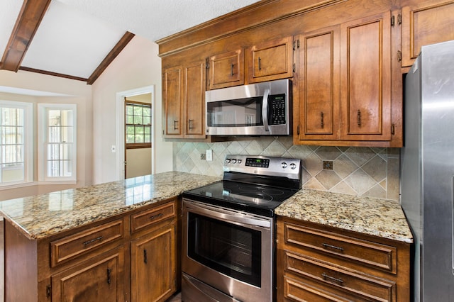 kitchen with brown cabinets, vaulted ceiling with beams, a peninsula, light stone countertops, and stainless steel appliances