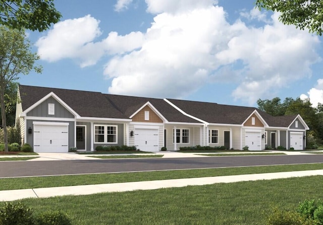 single story home featuring a garage, board and batten siding, and a front yard