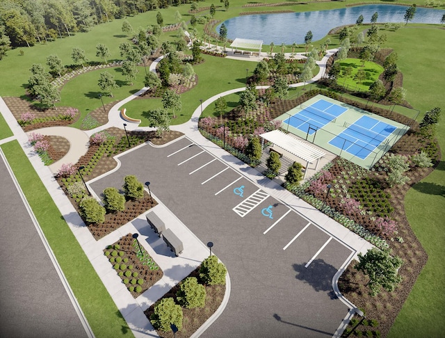 birds eye view of property with a water view