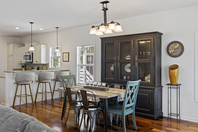 dining space featuring dark wood-style floors and recessed lighting