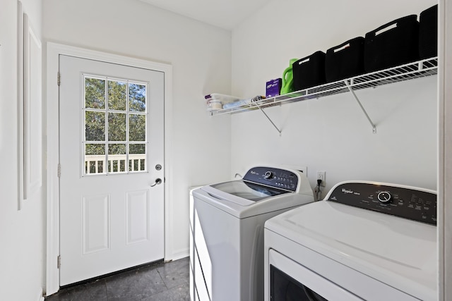 laundry area with laundry area and washer and clothes dryer