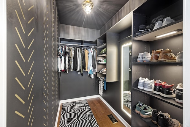 spacious closet with visible vents and wood finished floors