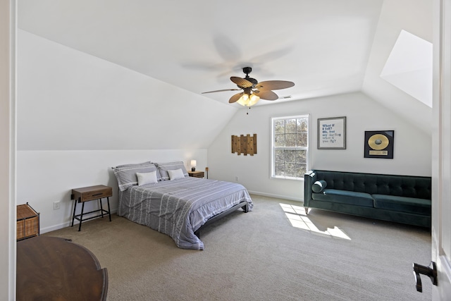 carpeted bedroom featuring lofted ceiling, ceiling fan, and baseboards