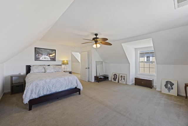 bedroom featuring baseboards, visible vents, a ceiling fan, vaulted ceiling, and carpet floors