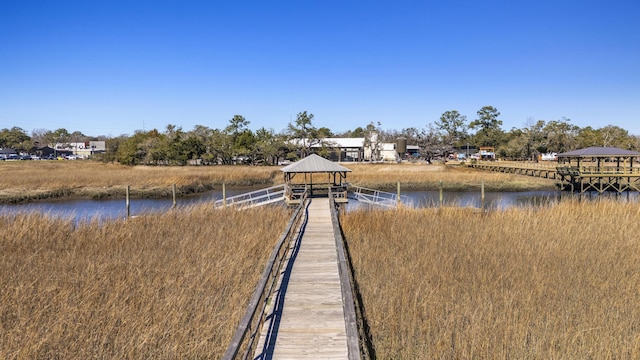 dock area with a gazebo and a water view