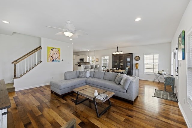 living room featuring baseboards, stairway, hardwood / wood-style floors, and recessed lighting