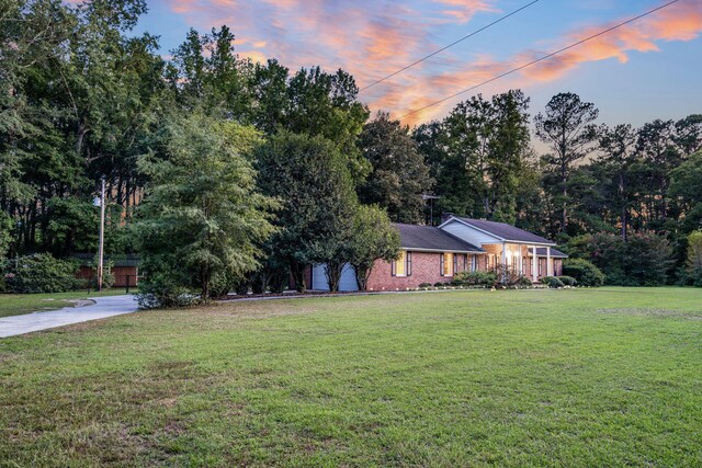 view of yard at dusk