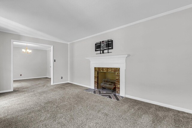 unfurnished living room with baseboards, a fireplace with flush hearth, ornamental molding, a notable chandelier, and carpet flooring