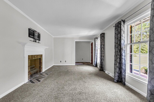 unfurnished living room featuring visible vents, ornamental molding, carpet floors, baseboards, and a tile fireplace