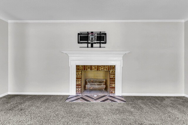 interior details featuring baseboards, carpet, ornamental molding, and a fireplace