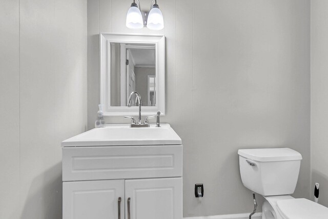 bathroom featuring toilet and vanity