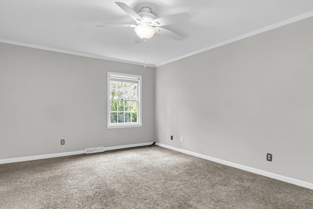 unfurnished bedroom with crown molding, baseboards, and carpet floors