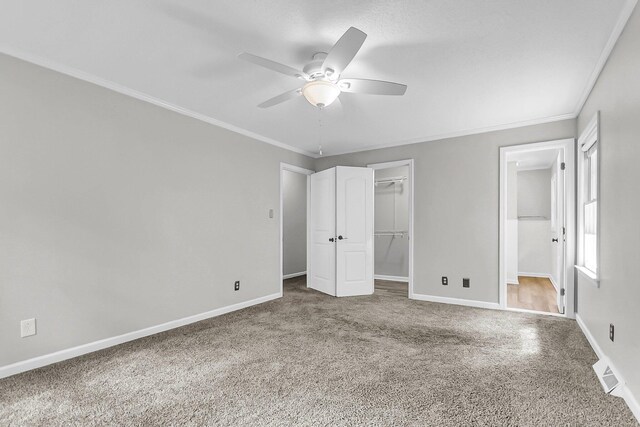 full bath featuring vanity, baseboards, ornamental molding, curtained shower, and toilet