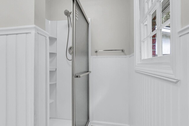 unfurnished bedroom featuring a closet, baseboards, carpet, and ornamental molding