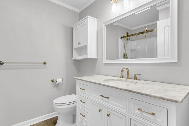 unfurnished bedroom featuring a walk in closet, visible vents, ornamental molding, baseboards, and ceiling fan